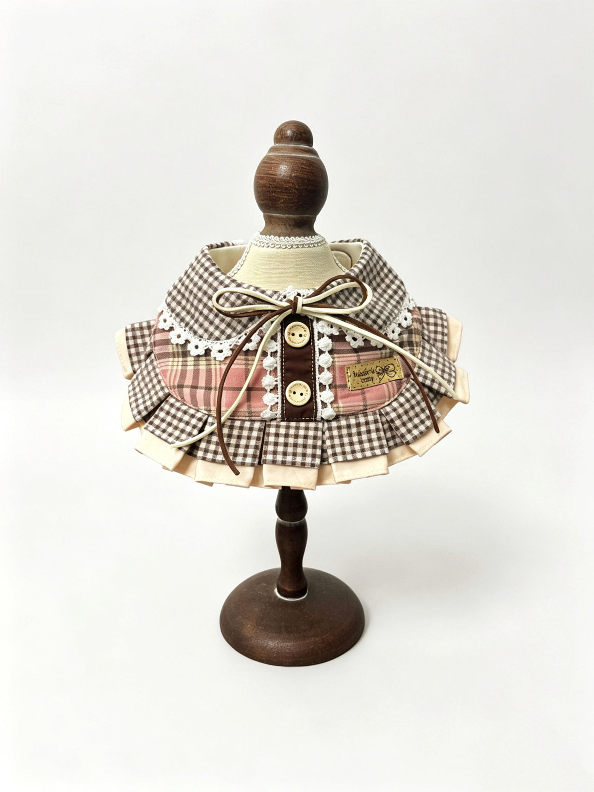 Brown gingham ruffle bib with lace and bow